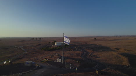 the flag symbolizing israel's war is in the golan heights on the tel saki bunker that was used in the war, the site of one of the most critical battles of the yom kippur war on 1973