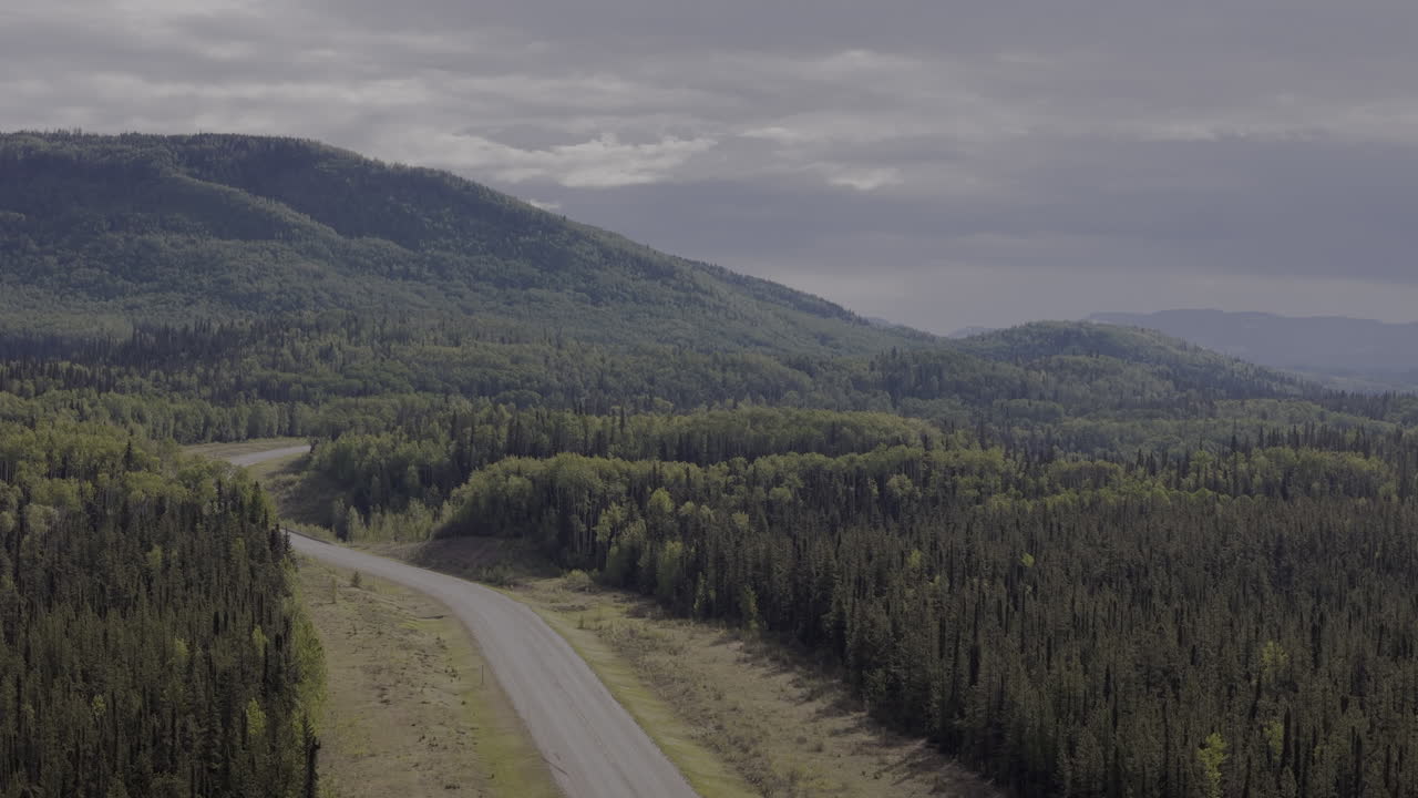 Epic stretch of the Alaska Highway winding through wilderness.