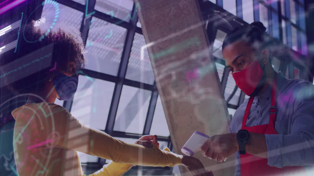 Data processing against african american male waiter checking temperature of a woman at a cafe