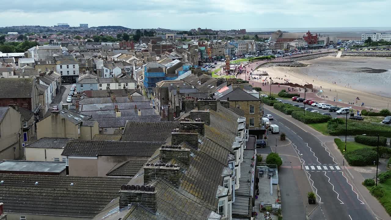 Morecambe town seaside properties aerial view overlooking sunny waterfront promenade street
