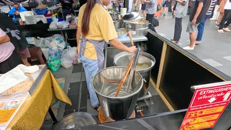 street food vendor preparing noodles