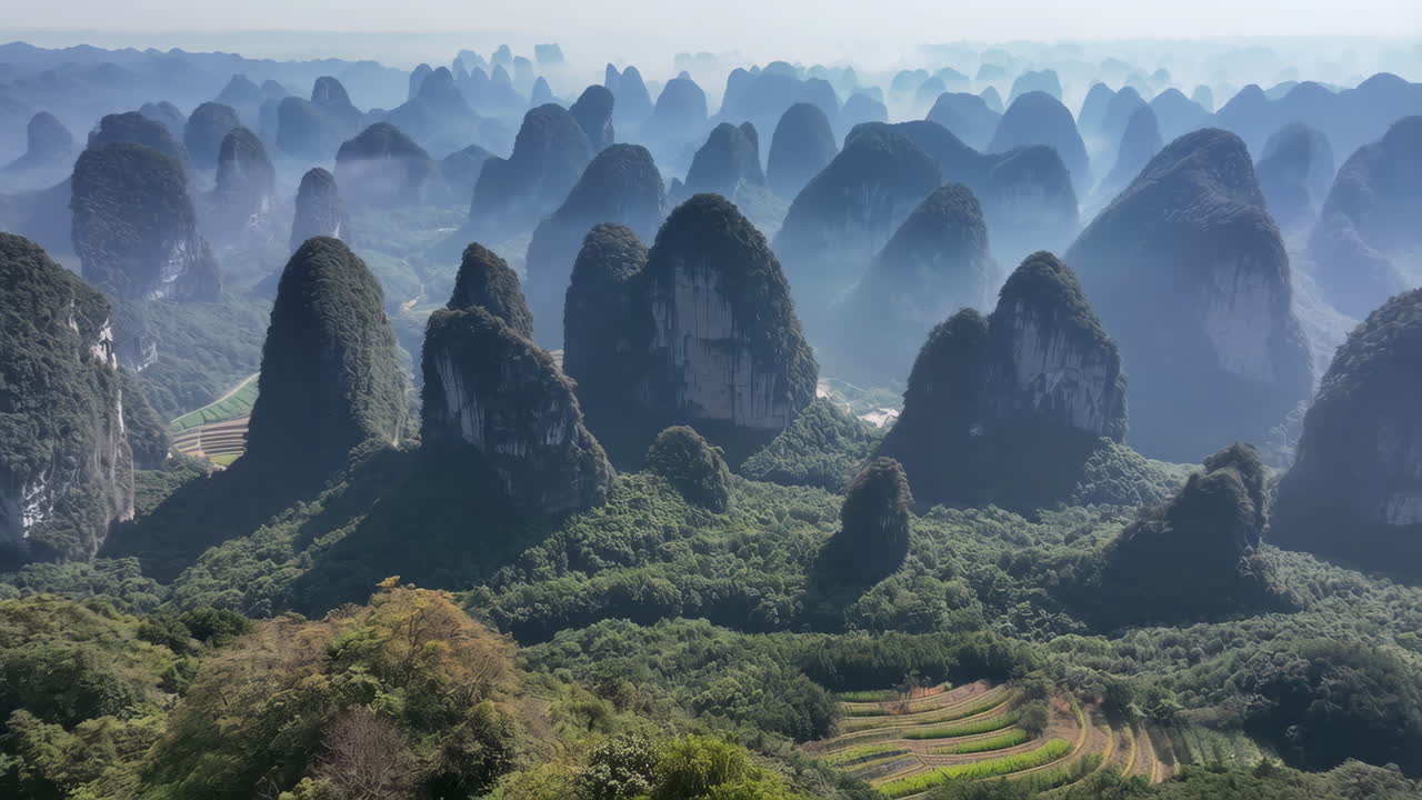 Misty Karst Mountain Landscape with Terraced Fields