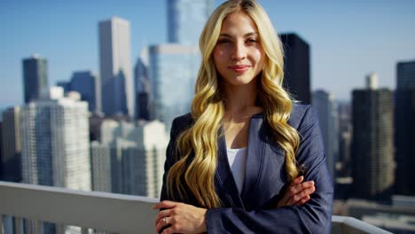 portrait of caucasian american businesswoman on skyscraper rooftop