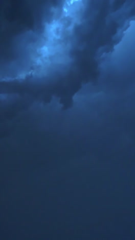 dark storm clouds before rain. light in the dark and dramatic storm clouds background