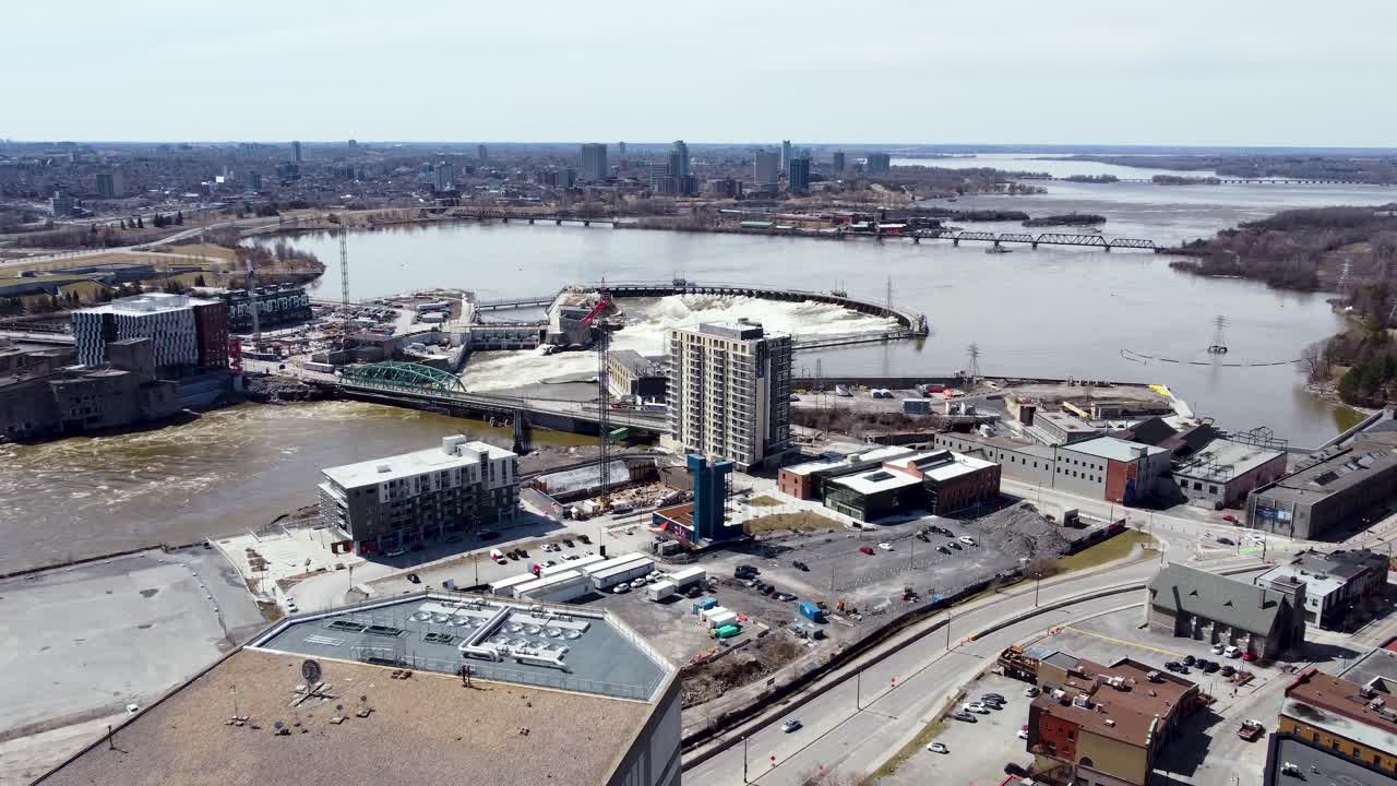 Flying towards a hydro electric dam on the Ottawa River near Gatineau and downtown Ottawa