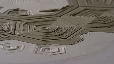 abstract concentric hexagonal relief pattern