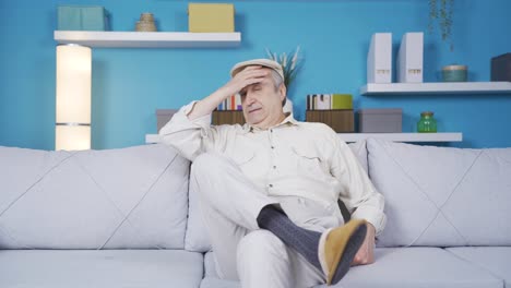 pensive and confused old man at home thoughtful.