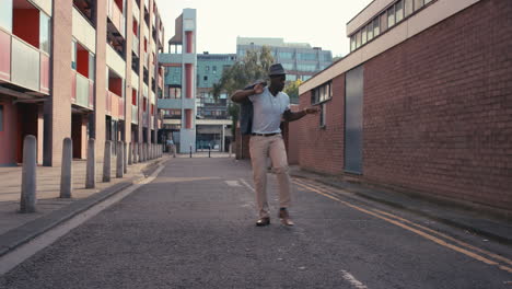 Contemporary-funky-African-American-man-street-dancer-dancing-freestyle-in-the-city