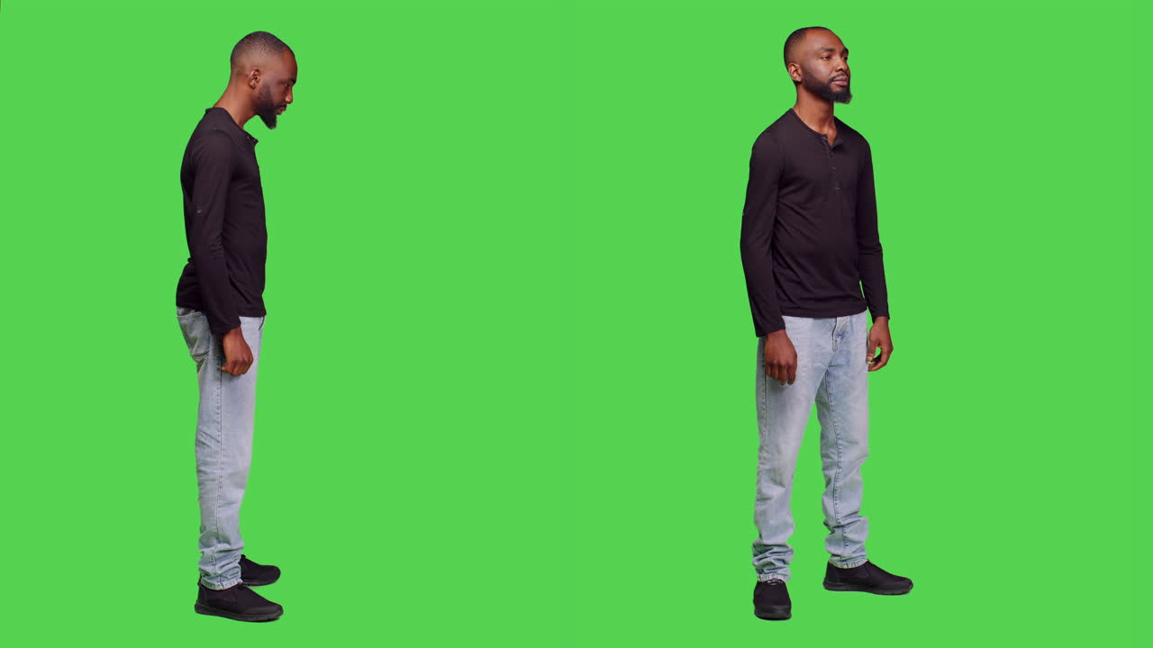 Man in black long sleeve shirt and jeans on green screen