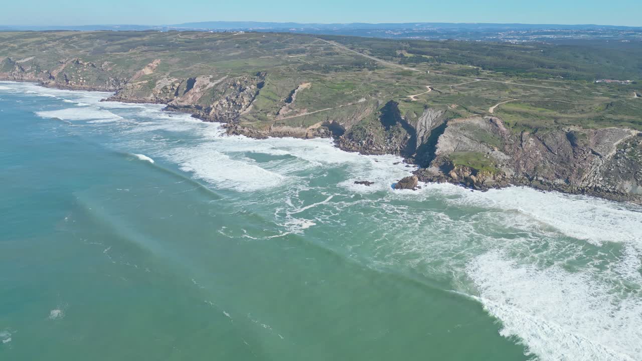 Cliffs and waves at miradouro da salgado, nazaré, portugal coast, aerial view