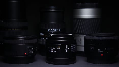 the light moves over the camera lenses on a black dark background