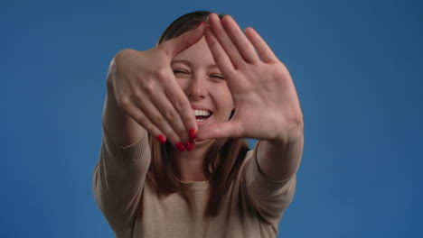 woman framing face with hands