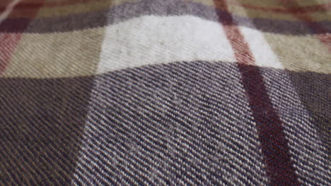 close up slide over a plaid shirt