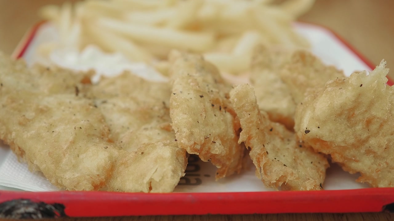 Delicious Golden Fried Fish and French Fries Served on a Plate