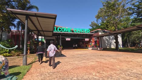 people walking towards the zoo's welcome center