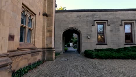 person walking through university archway