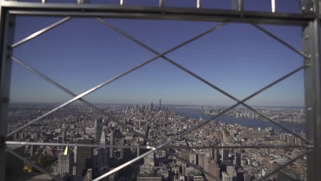 pov looking through fence empire state building nyc 4k