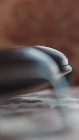 classic black leather men shoes on pillow in studio extreme close view. formal style and fashionable accessories. comfortable male footwear items