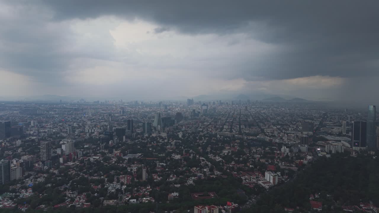 See Mexico City from above during rainy period, filmed by drone