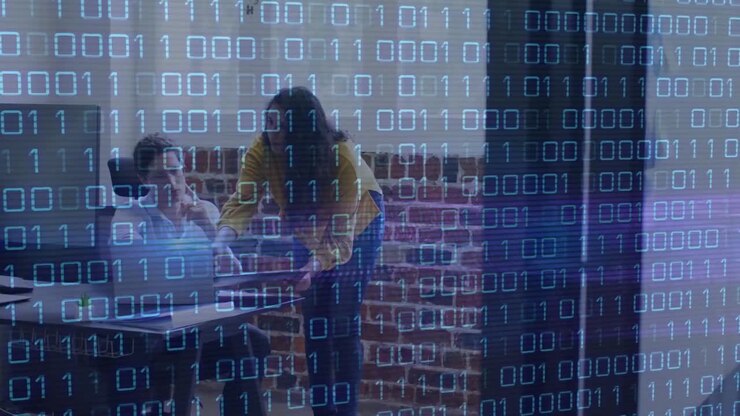 Animation of looping binary codes over diverse coworkers discussing reports in office