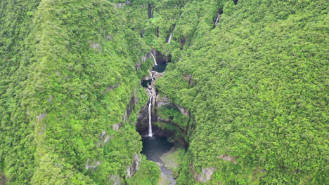 aerial view over the takamaka waterfalls on the marsouins river, reunion island