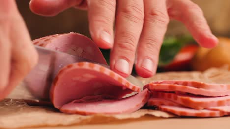 ham italian mordatella, man slices of traditional italian antipasti mortadella sausage on a wooden cutting board, close up macro of chicken or turkey jamon, fat breakfast dish.