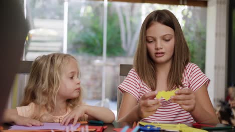 mother and daughters painting together