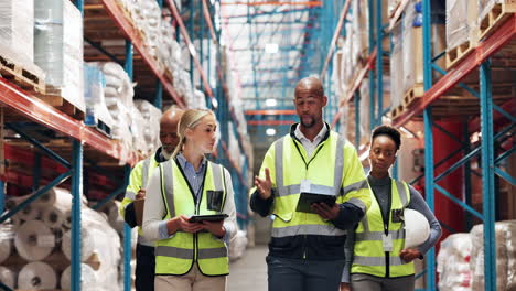 diverse group of workers walking through a warehouse