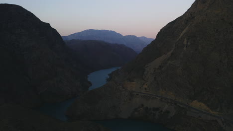 blue river surrounded by big mountain with beautiful light and sky