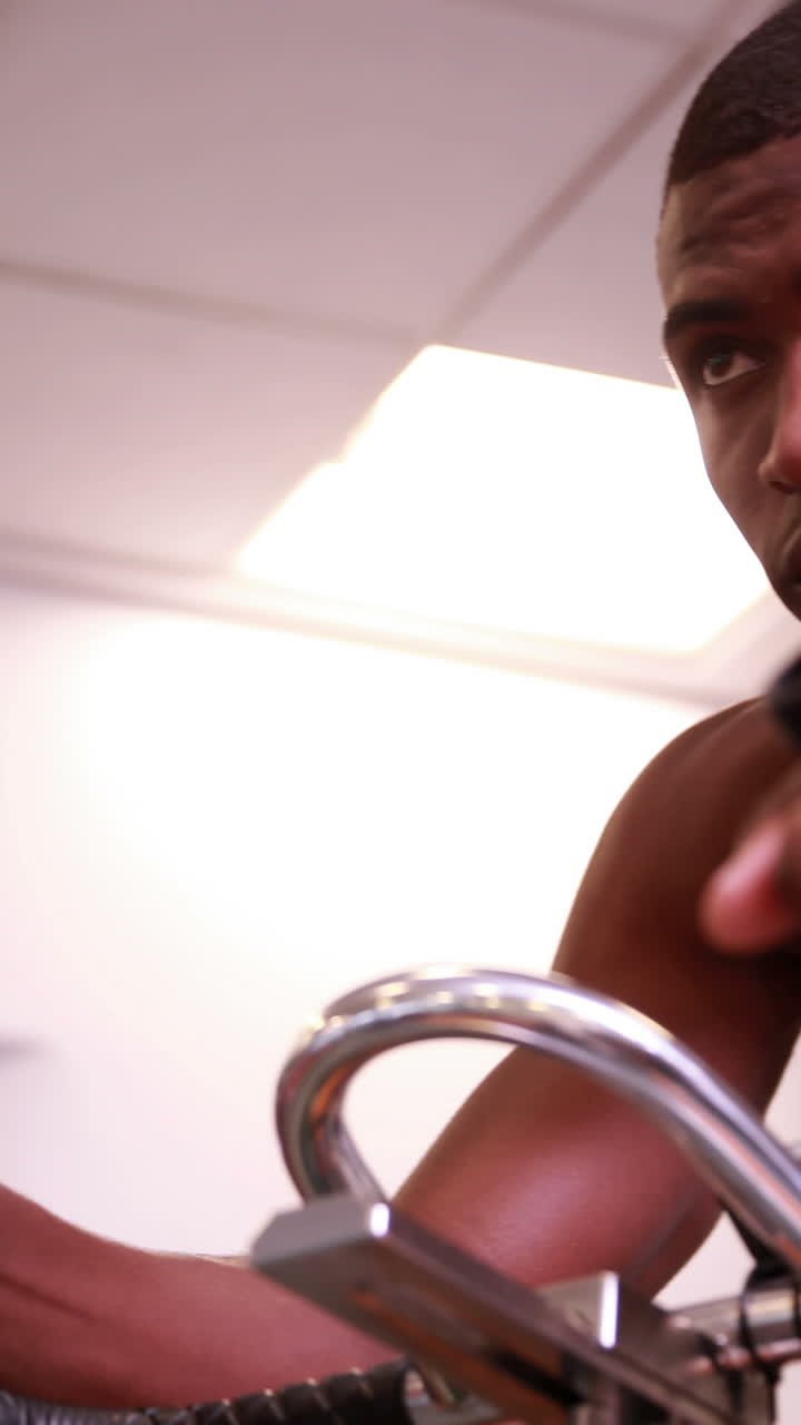 Fit man working out on the exercise bike