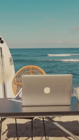 desktop office worker with laptop on sea beach for freelancer working remotely