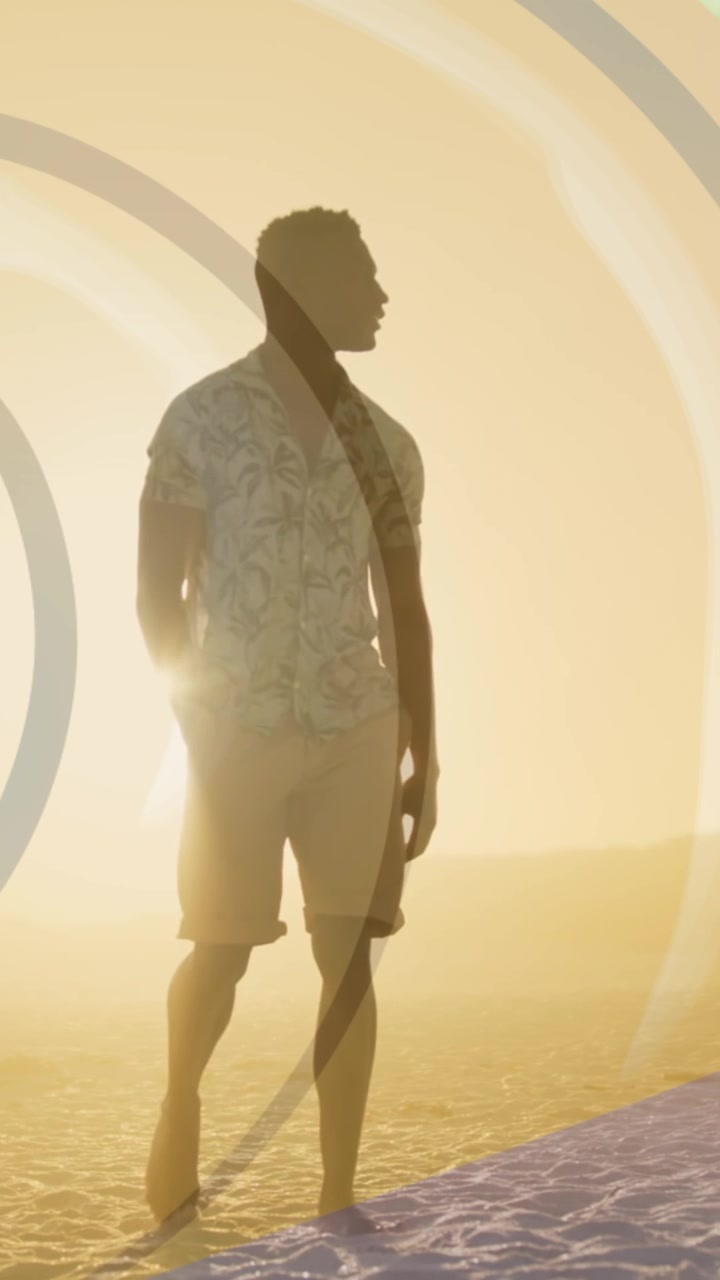 Animation of spiral over african american man standing on beach