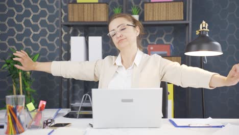sleepy business woman yawns looking at camera.