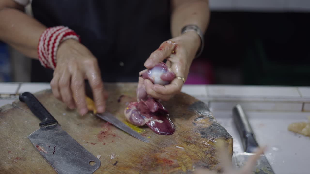 Preparing Poultry Offal at a Market
