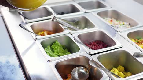 self-service salad bar with various food options