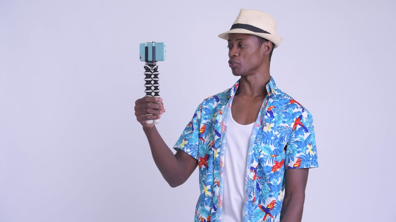 Young handsome African tourist man ready for vacation