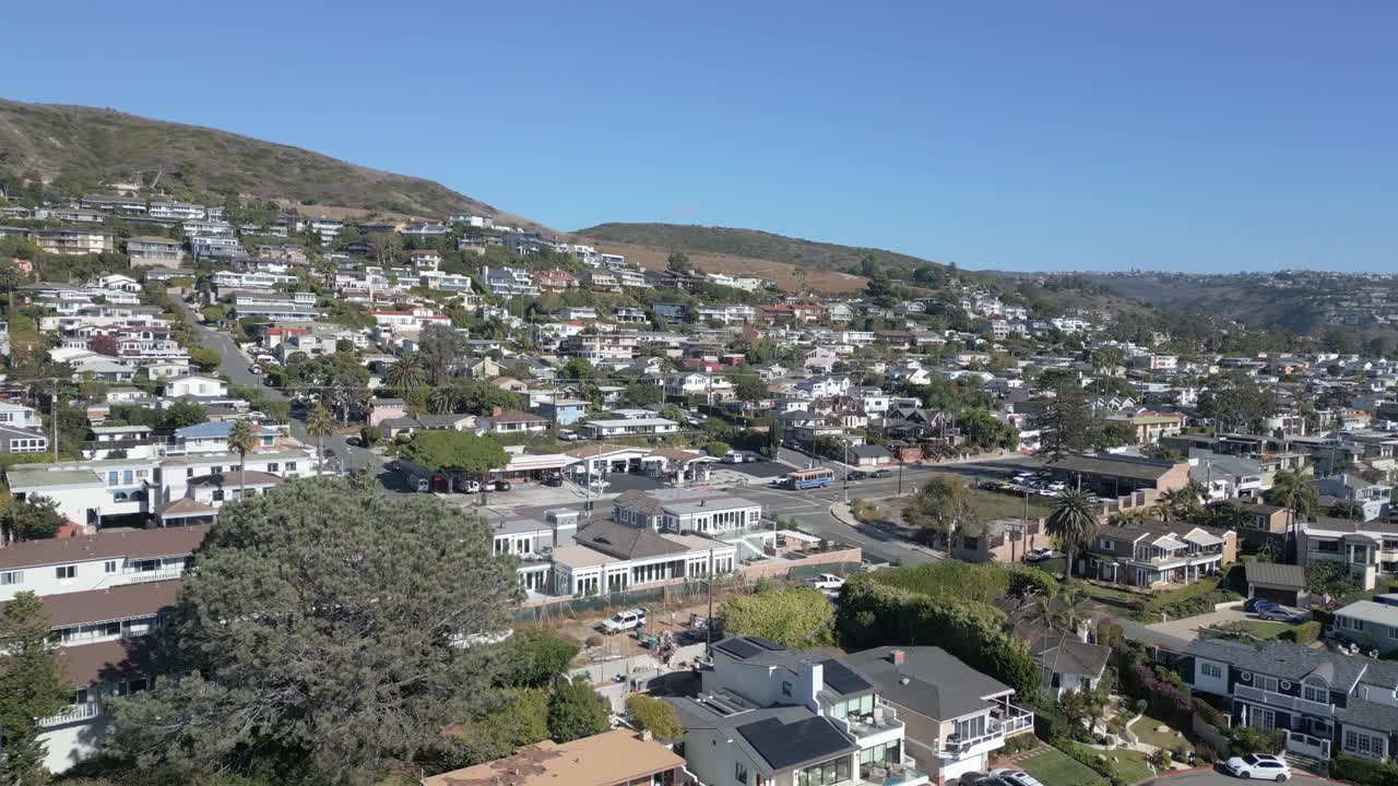 Calm 4K drone shot flying over homes in Laguna Beach, California. Slow motion capable, perfect for residential, travel, coastal, or cinematic lifestyle projects
