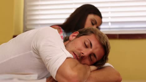 student sleeping on desk during class