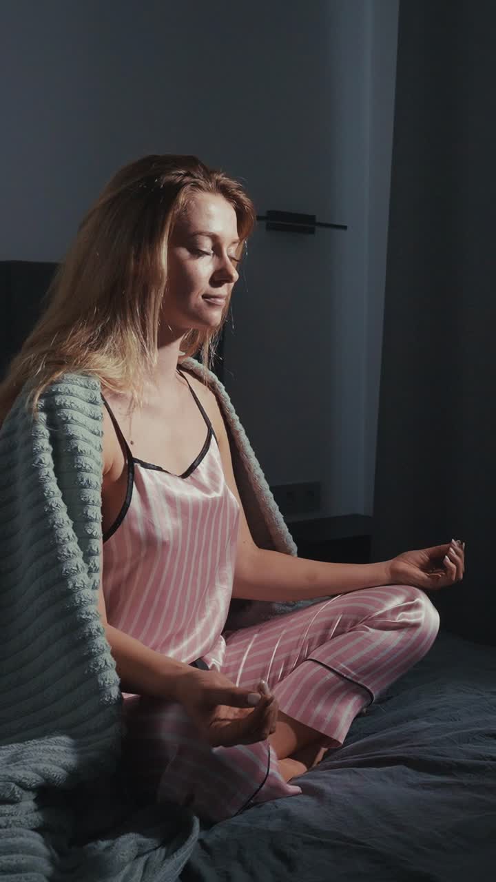 Woman Meditating in Pajamas