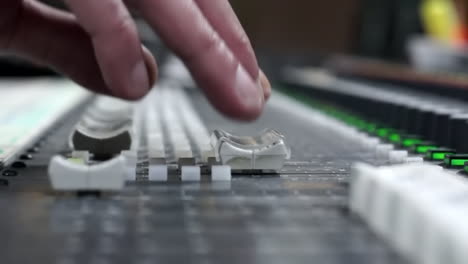 close-up of an audio mixing console