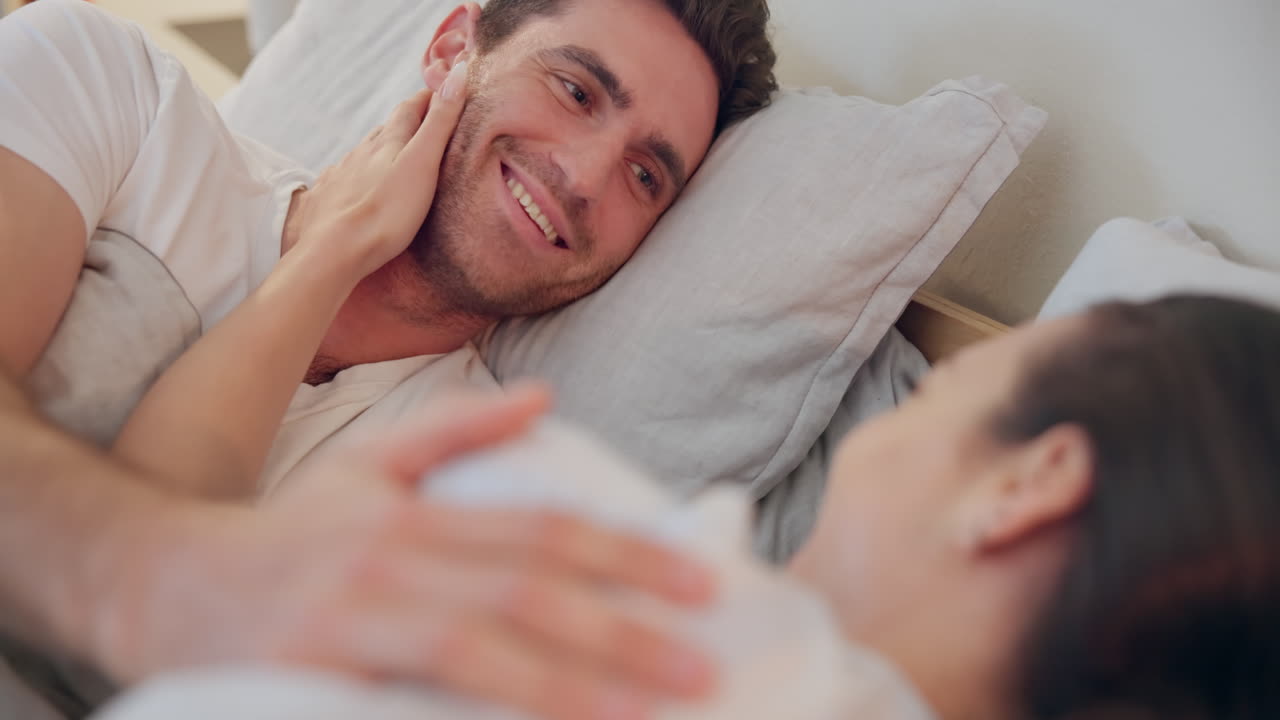 Face, love and happy with a couple in bed together