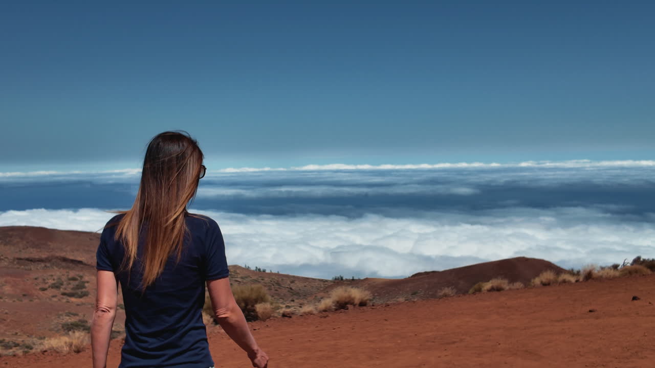 Tourist enjoying panoramic views above the clouds in Tenerife, Canary Islands