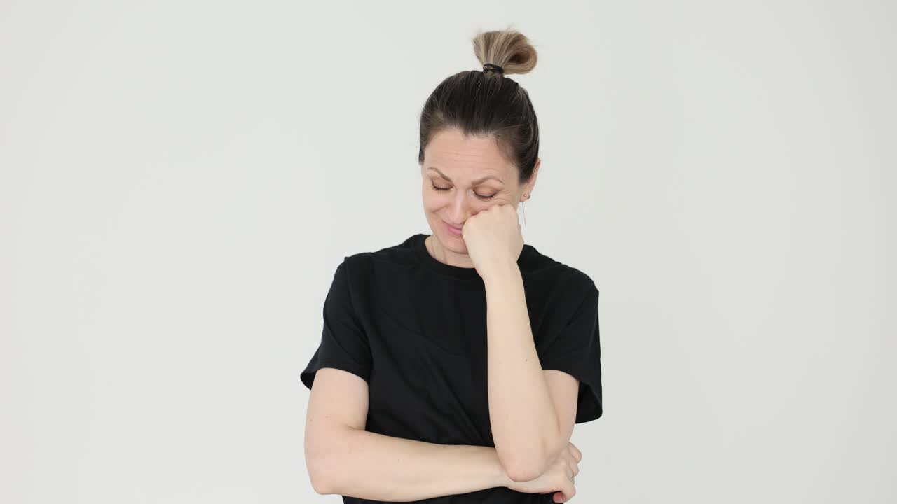 Upset woman crying and covering her face