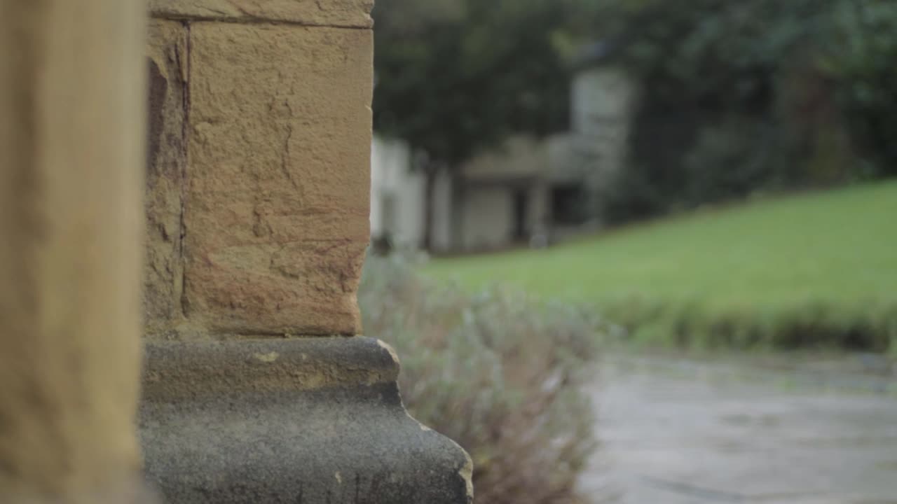 View of garden through stone pillars in English church