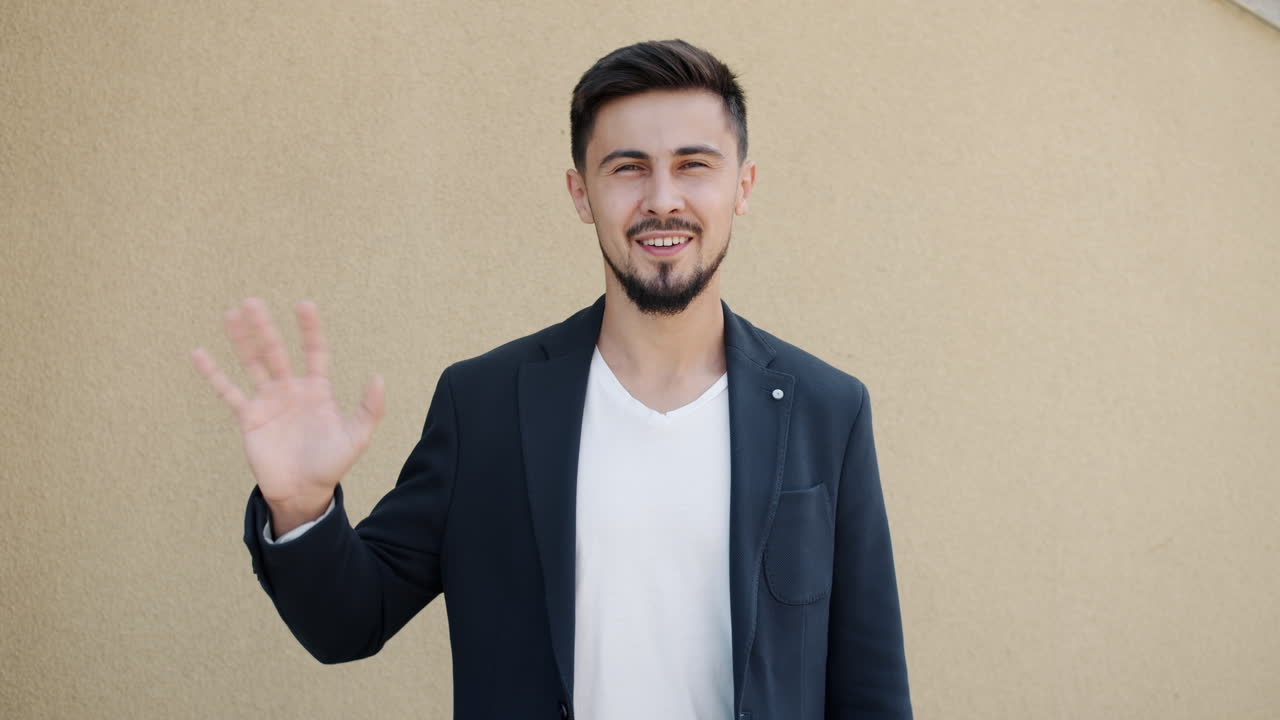 Man Waving in a Business Attire
