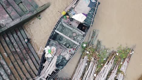 Aerial-view-of-historical-town-on-the-bank-of-the-Ganges-river-front-view-of-Ghats-and-wooden-boats-Kolkata,-West-Bengal-India-city