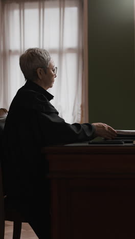 judge reviewing documents in a court setting