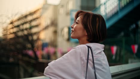 woman in a city at sunset