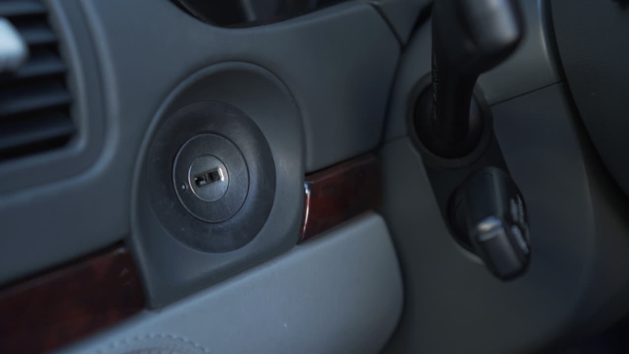 Older Man Starting a Car