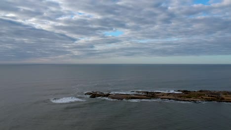 Drone advancing the rock on the ocean shore on Uruguay
